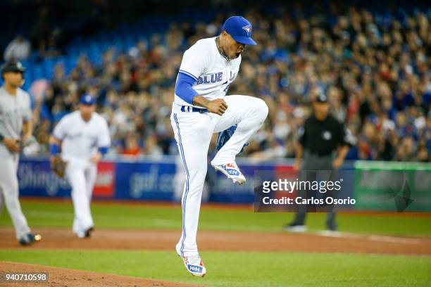 Blue Jays starter Marcus Stroman reacts after striking out Neil Walker of the Yankees to end the1st inning of MLB action as the Toronto Blue Jays...