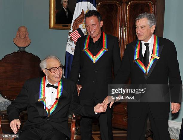 Kennedy Center honorees (L-R Dave Brubeck, Bruce Springsteen, and Robert De Niro congratulate one another after posing for the formal group photo...