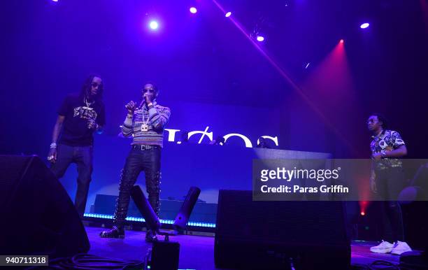 Rappers Migos perform onstage in concert during V-103 Live Pop Up Concert at Philips Arena on March 31, 2018 in Atlanta, Georgia.