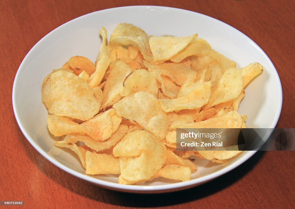 A bowl of salty kettle cooked potato chips