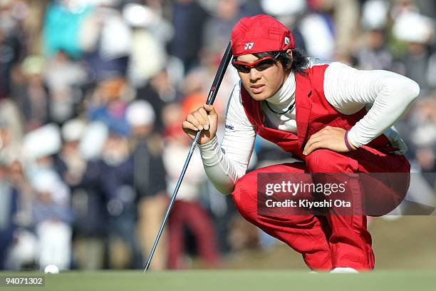 Ryo Ishikawa of Japan lines up a putt on the green of the 17th hole during the final round of the Nippon Series JT Cup at Tokyo Yomiuri Country Club...