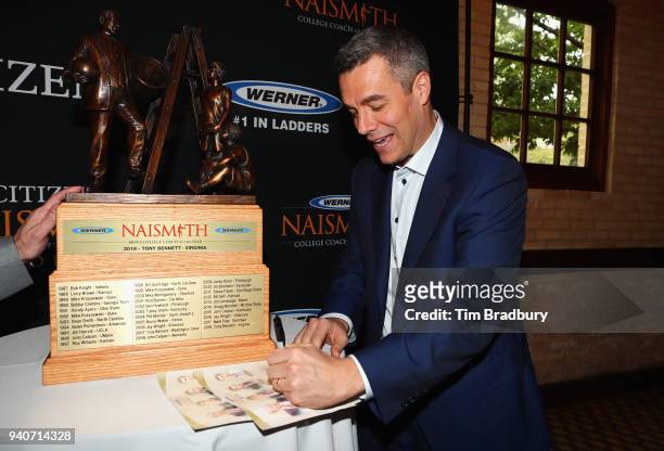 Werner Ladder Naismith Men's College Coach of the Year Tony Bennett of the Virginia Cavaliers signs autographs during the 2018 Naismith Awards Brunch...