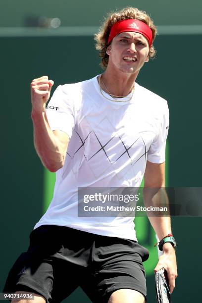 Alexander Zverev of Germany celebrates a point against John Isner during the men's final of the Miami Open Presented by Itau at Crandon Park Tennis...