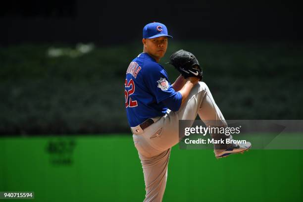 Jose Quintana of the Chicago Cubs warms up in the first inning against the Miami Marlins at Marlins Park on April 1, 2018 in Miami, Florida.