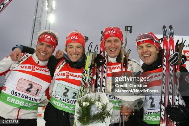 The second placed Norwegian Relay Team Emil Hegle Svendsen, Alexander Os, Lars Berger and Ole Einar Bjoerndalen pose after the Men's 4x7.5 km Relay...