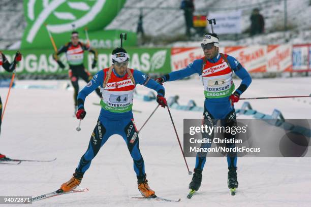 Martin Fourcade of France takes over from Simon Fourcade of France during the Men's 4x7.5 km Relay in the E.ON Ruhrgas IBU Biathlon World Cup on...