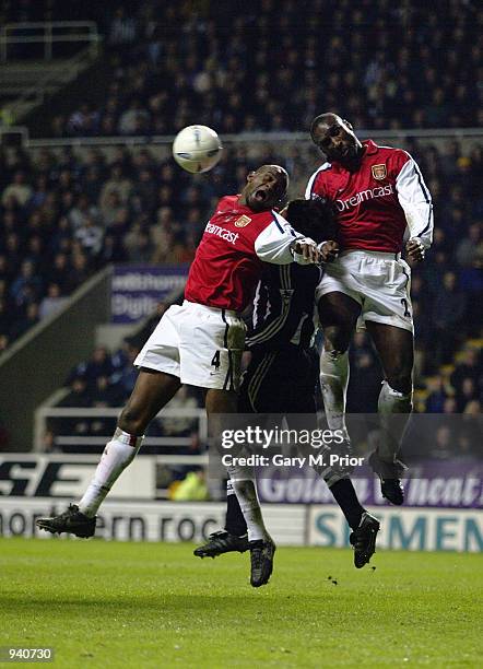 Patrick Vieira and Sol Campbell of Arsenal stop Clarence Acuna of Newcastle United winning the ball in the air during the AXA sponsored FA Cup...