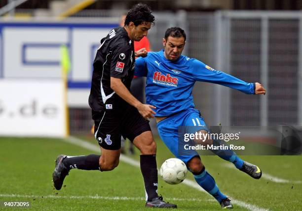 Mahir Saglik of Paderborn and Tiago of Duisburg battle for the ball during the Second Bundesliga match between SC Paderborn and MSV Duisburg at the...