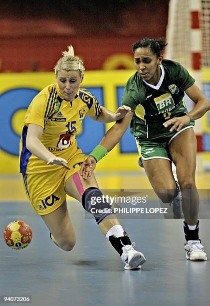 Sweden's Johanna Ahlm and Brazil's Ana Paula Rodrigues vie for the ball during the preliminary round match between Brazil and Sweden at the women's...