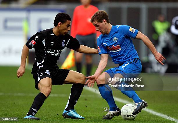 Soeren Halfar of Paderborn and Aenis Ben Hatira of Duisburg battle for the ball during the Second Bundesliga match between SC Paderborn and MSV...