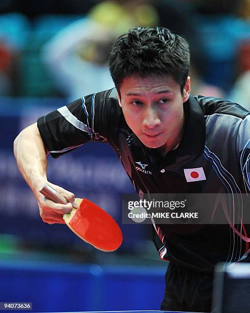 Kaii Yoshida of Japan returns to Zhang Ji Ke of China during their men's team table tennis competition finals match at the 2009 East Asian Games in...