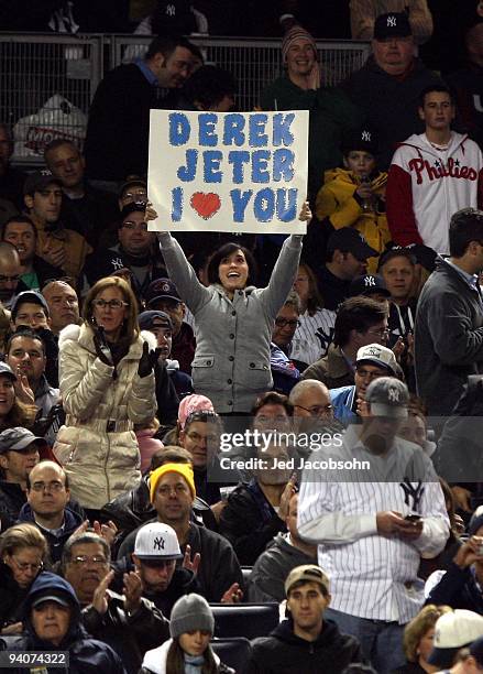 Fan of the New York Yankees holds up a sign which reads "Derek Jeter I Love You" in reference to Yankee shortstop Derek Jeter against the...