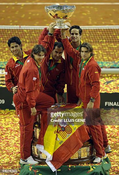 Spain's Fernando Verdasco, Rafael Nadal, team captain Albert Costa, Feliciano Lopez and David Ferrer celebrate after winning the Davis cup final...