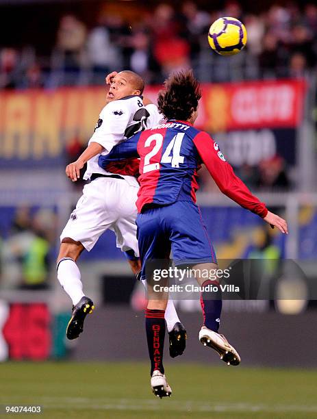 Emiliano Moretti of Genoa CFC competes for the ball with Jonathan Biabiany of Parma FC during the Serie A match between Genoa and Parma at Stadio...