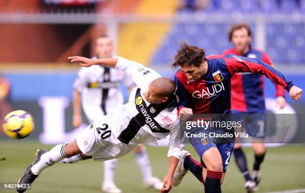 Emiliano Moretti of Genoa CFC competes for the ball with Jonathan Biabiany of Parma FC during the Serie A match between Genoa and Parma at Stadio...