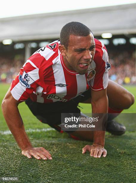 Anton Ferdinand of Sunderland grimaces as he is injured during the Barclays Premier League match between Fulham and Sunderland at Craven Cottage on...