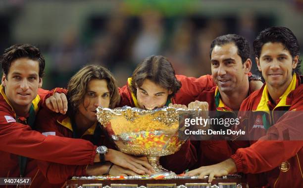 Spanish players Feliciano Lopez , David Ferrer , Rafael Nadal, team captain Albert Costa and Fernando Verdasco celebrate with the Davis Cup trophy at...