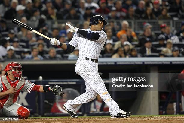 Robinson Cano of the New York Yankees bats against the Philadelphia Phillies in Game Two of the 2009 MLB World Series at Yankee Stadium on October...