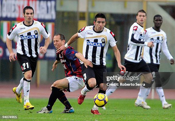 Andrea Coda of Udinese competes with Adailton of Bologna during the Serie A match between Bologna and Udinese at Stadio Renato Dall'Ara on December...