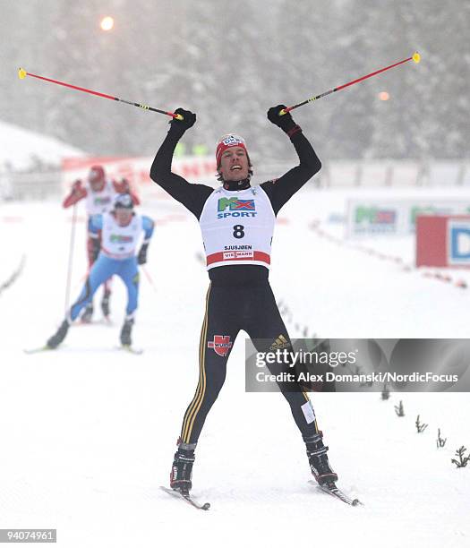 Tino Edelmann of Germany celebrates after winning the Gundersen 10km event during day two of the FIS Nordic Combined World Cup on December 6, 2009 in...