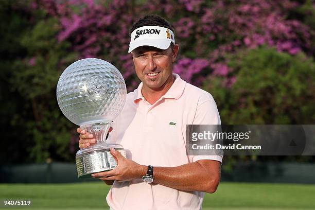 Robert Allenby of Australia holds the trophy after the final round of the Nedbank Golf Challenge at the Gary Player Country Club at Sun City, on...
