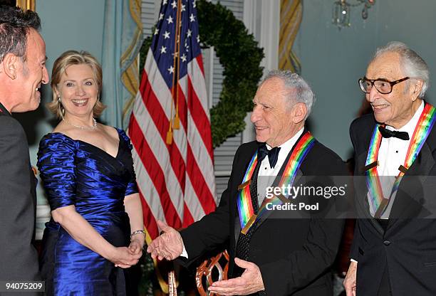 United States Secretary of State Hillary Rodham Clinton, left center, share a smile with Bruce Springsteen, Mel Brooks and Dave Brubeck as they...