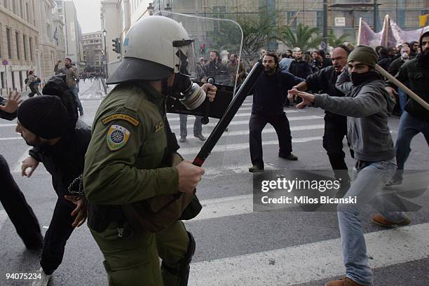 Greek youths clash with riot police during a demonstration commemorating the fatal shooting of 15-year-old Alexandros Grigoropoulos' by police a year...