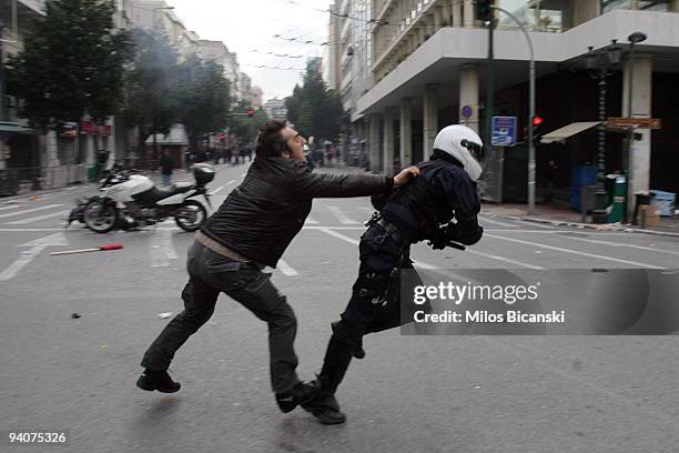 Greek youths clash with riot police during a demonstration commemorating the fatal shooting of 15-year-old Alexandros Grigoropoulos' by police a year...