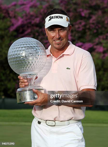 Robert Allenby of Australia holds th etrophy after the final round of the Nedbank Golf Challenge at the Gary Player Country Club at Sun City, on...