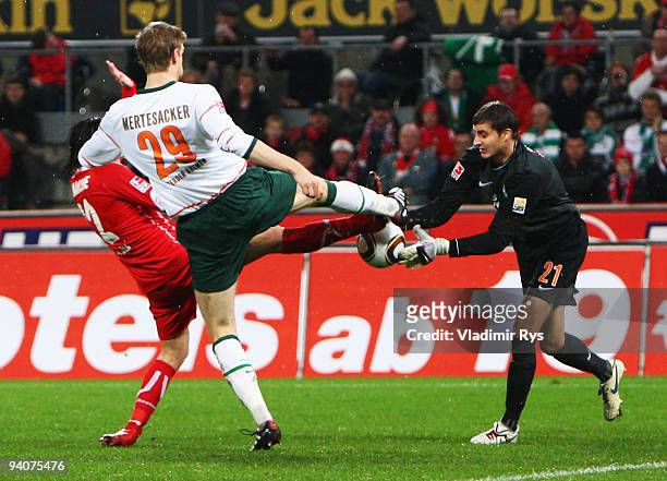 Goalkeeper Sebastian Mielitz of Bremen makes a save during the Bundesliga match between 1. FC Koeln and SV Werder Bremen at RheinEnergie Stadium on...