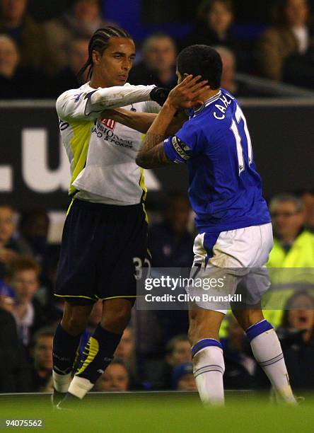 Tim Cahill of Everton clashes with Benoit Assou- Ekotto of Tottenham Hotspur during the Barclays Premier League match between Everton and Tottenham...