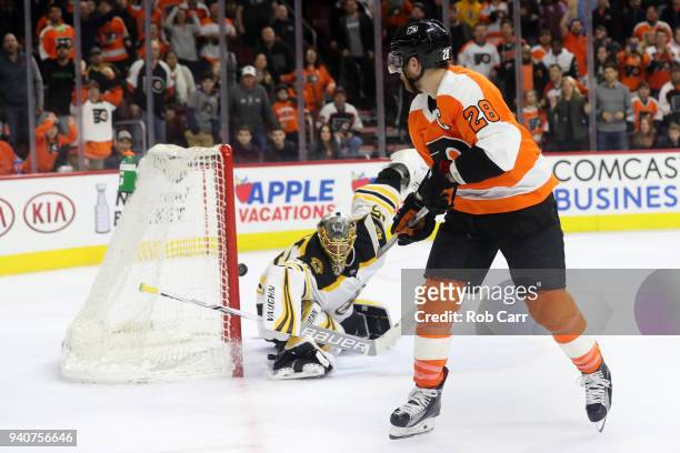 Claude Giroux of the Philadelphia Flyers follows his game winning overtime goal past goalie Anton Khudobin of the Boston Bruins during the Flyers 4-3...