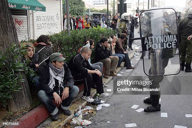 Riot police detain protestors during a demonstration commemorating the fatal shooting of 15-year-old Alexandros Grigoropoulos' by police a year ago,...