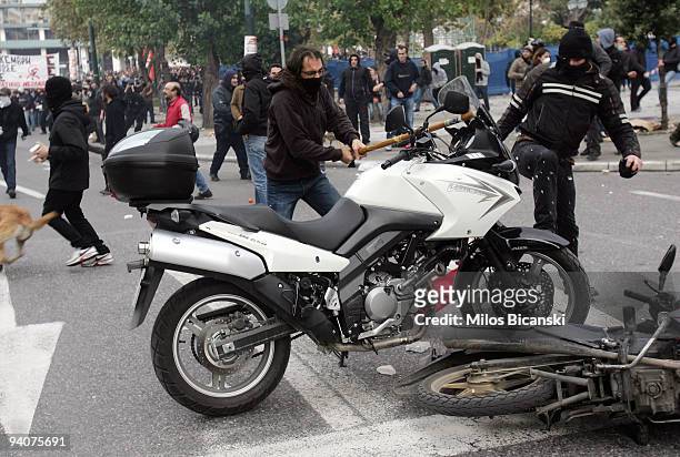 Greek youths destroy police motorbikes during a demonstration commemorating the fatal shooting of 15-year-old Alexandros Grigoropoulos by police a...