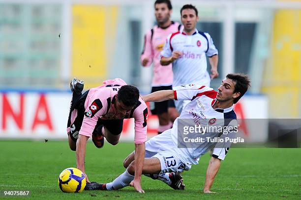 Igor Budan of Palermo and Davide Astori of Cagliari battle for the ball during the Serie A match between US Citta di Palermo and Cagliari Calcio at...