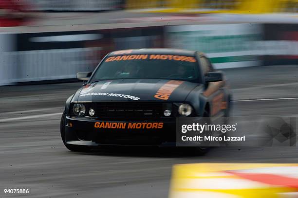 Andrea Dovizioso of Italy and Ford Mustang drives during the Yokohama Superbikers Drifting during the Motor Show 2009 on December 6, 2009 in Bologna,...