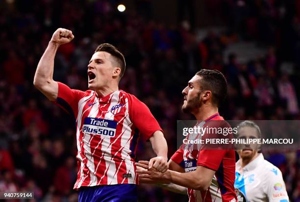 Atletico Madrid's French forward Kevin Gameiro celebrates a goal during the Spanish League football match between Atletico Club Atletico de Madrid...