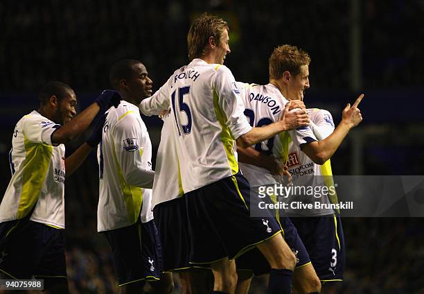 Michael Dawson of Tottenham Hotspur celebrates scoring his team's second goal with his team mates during the Barclays Premier League match between...