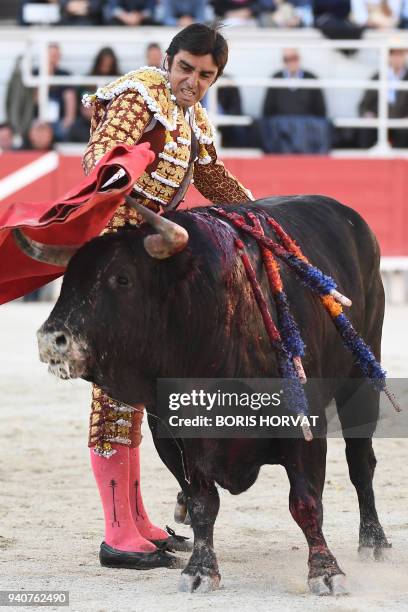 Spanish bullfighter Miguel Angel Perera perfoms a pass to a Spanish Jandilla bull during the Feria du Riz, on April 1, 2018 in Arles, southern...