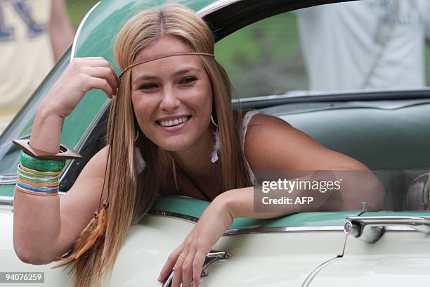 Israeli supermodel Bar Refaeli poses inside a vintage car during a photo session on December 6, 2009 for a new campaign for the Israeli fashion house...