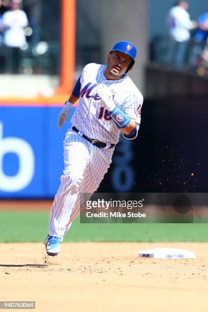 Travis d'Arnaud of the New York Mets hits a solo home run in the fourth inning against the St. Louis Cardinals at Citi Field on March 31, 2018 in the...
