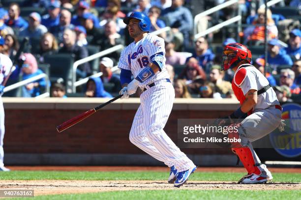Travis d'Arnaud of the New York Mets hits a solo home run in the fourth inning against the St. Louis Cardinals at Citi Field on March 31, 2018 in the...
