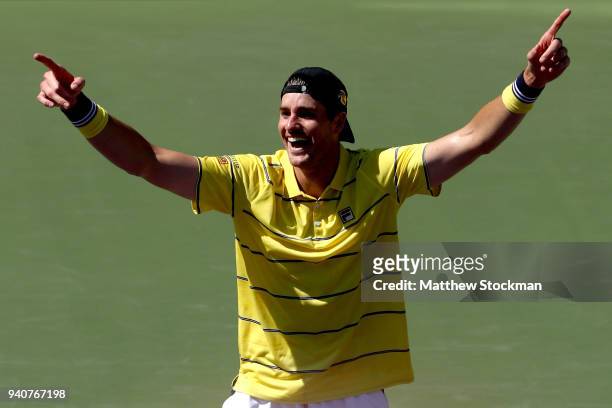 John Isner celebrates match point against Alexander Zverev of German during the men's final of the Miami Open Presented by Itau at Crandon Park...