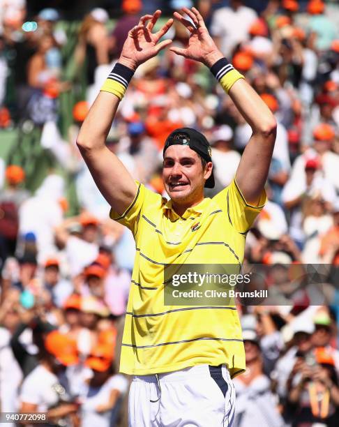 John Isner of the United States celebrates to the crowd after his three set victory against Alexander Zverev of Germany in the mens final during the...