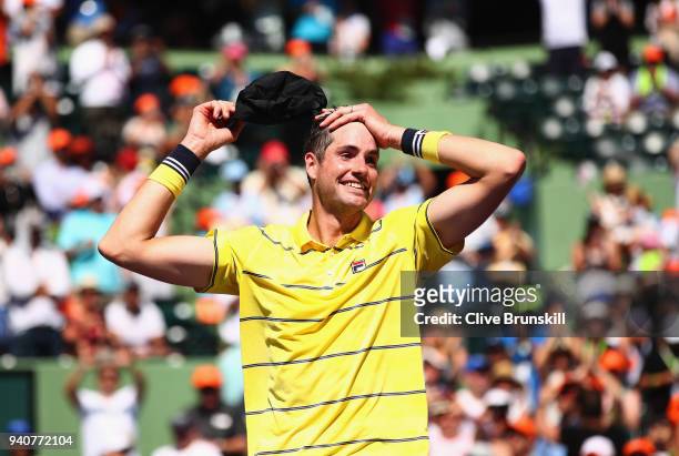 John Isner of the United States celebrates to the crowd after his three set victory against Alexander Zverev of Germany in the mens final during the...