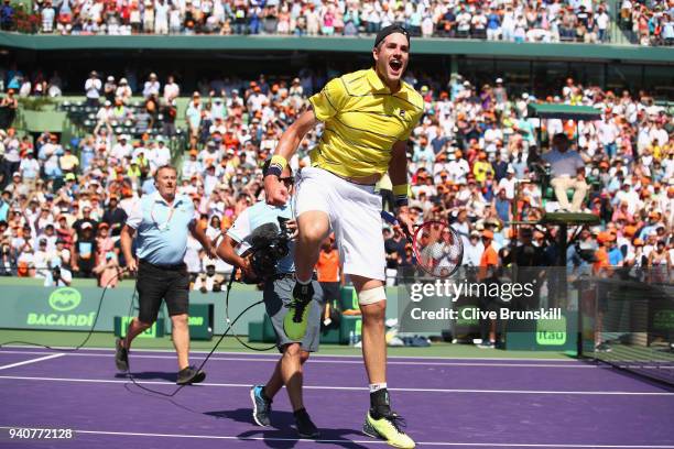 John Isner of the United States celebrates to the crowd after his three set victory against Alexander Zverev of Germany in the mens final during the...