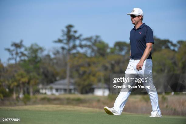 Jacques Blaauw walks to his next shot on the 18th green during the final round of the Web.com Tour's Savannah Golf Championship at the Landings Club...