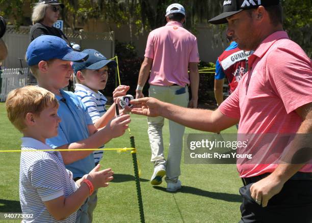 Kyle Thompson signs autographs and talks with young fans during the final round of the Web.com Tour's Savannah Golf Championship at the Landings Club...
