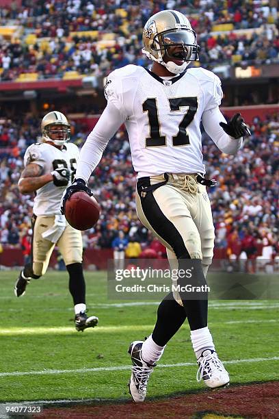 Robert Meachem of the New Orleans Saints scores a touchdown against the Washington Redskins on December 6, 2009 at FedExField in Landover, Maryland.