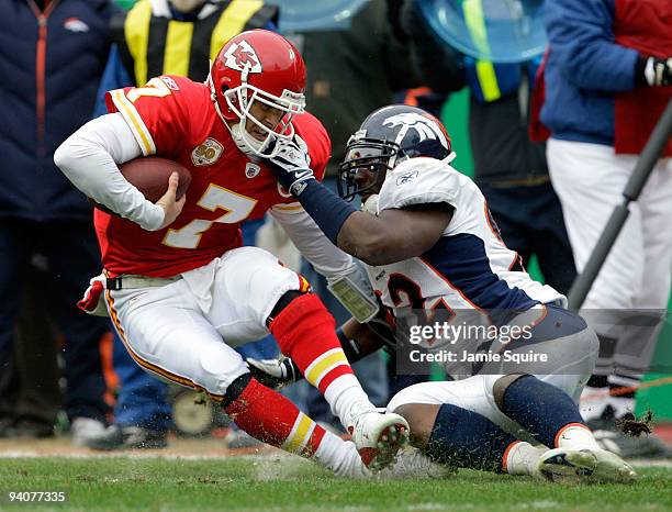 Quarterback Matt Cassel of the Kansas City Chiefs is sacked by Elvis Dumervil of the Denver Broncos during the game on December 6, 2009 at Arrowhead...
